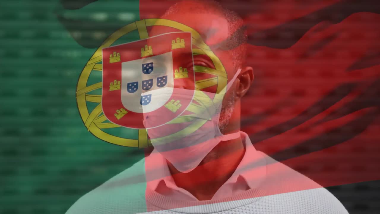Animação da bandeira de Portugal tremulando sobre homem afro-americano usando máscara facial em rua da cidade