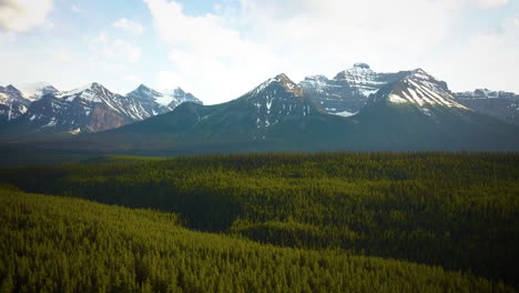 Snowy-mountain-peaks-in-a-vast-forest-wilderness