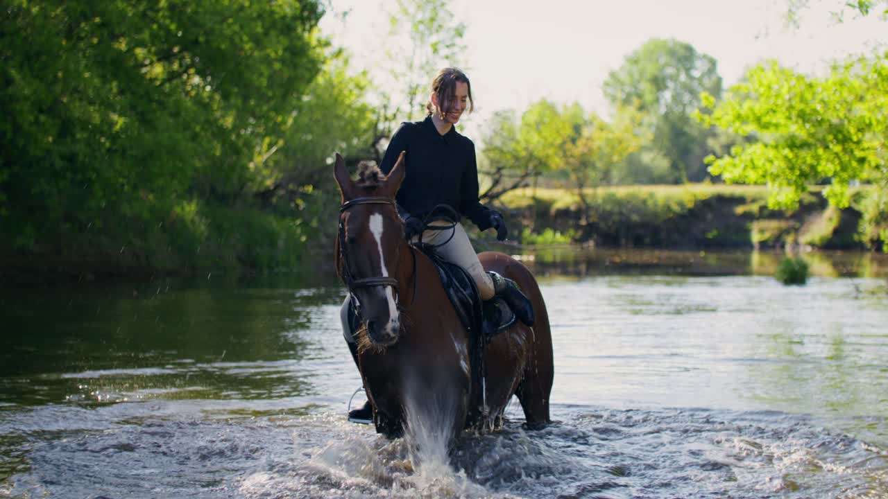 Woman Horseback Riding Through a River