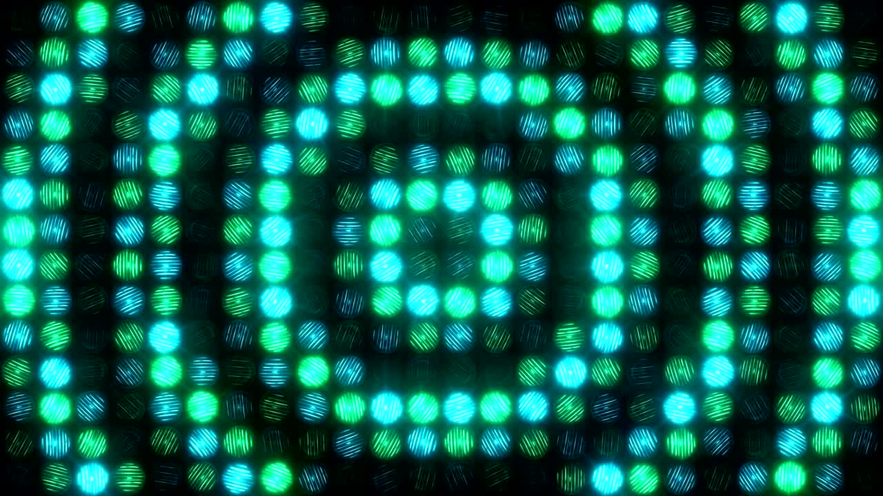 Una parete luminosa verde-blu lampeggia con grandi anelli pulsanti.