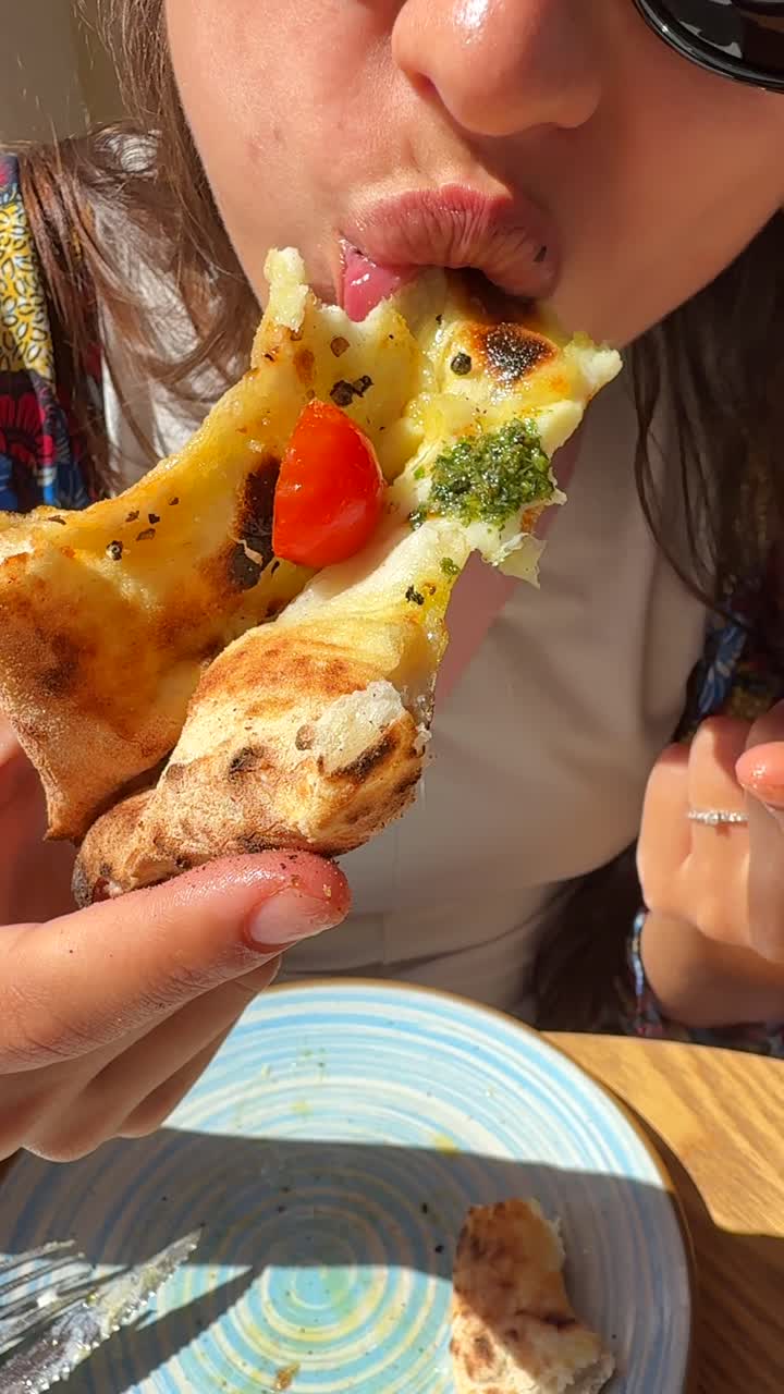 Eating a Delicious Pizza Slice