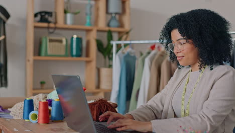 Black-woman,-laptop-or-fashion-designer-in-retail