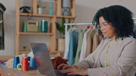 black woman, laptop or fashion designer in retail