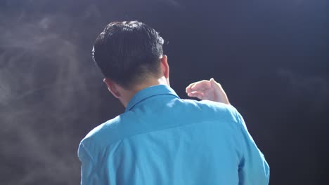 man in blue shirt with smoke effect