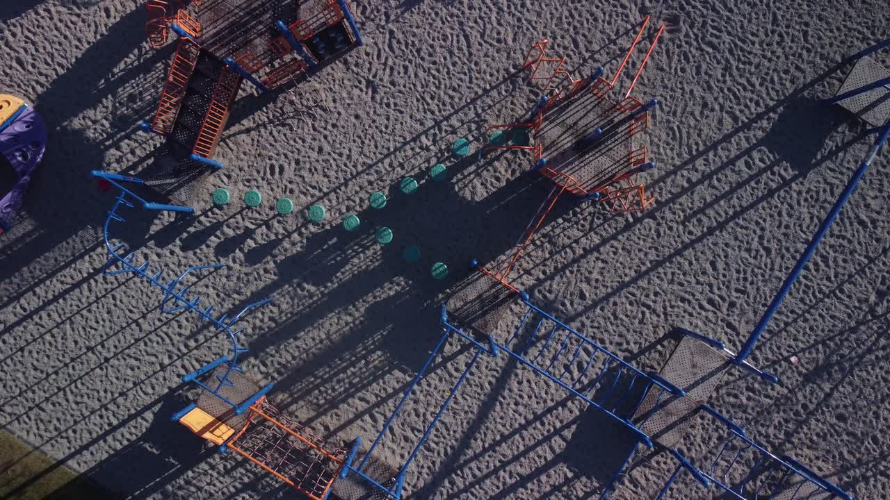 Empty School playground in the morning pull out vertical drone aerial
