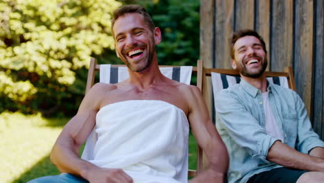 happy men laughing and relaxing outdoors