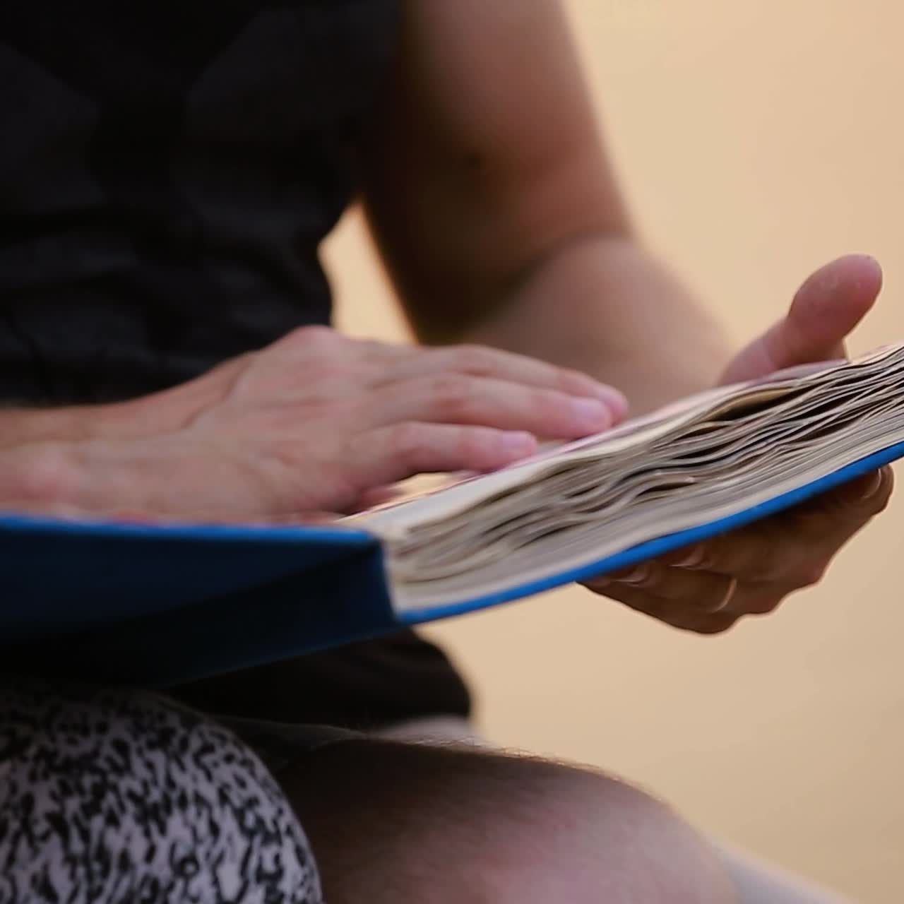 Holding Photo Album With Pictures. Hands holding photo album with picture in nature