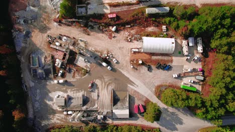 Stunning-aerial-tour-of-ready-mix-cement-supplier-with-mixer-trucks-loading-wet-concret