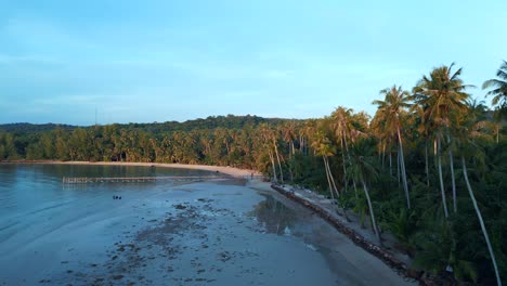 ebb-tideMajestic-aerial-top-view-flight-natural-beach-bay-thailand,-wood-pier-golden-hour,-lagoon-koh-kood-2022