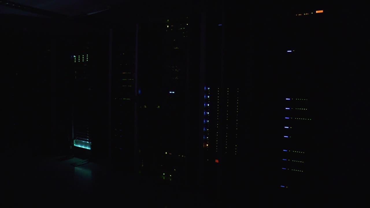 Indicator lights on a computer mainframe glow as information is processed