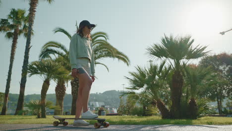 woman skateboarding in a park