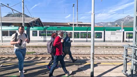 passengers walking on platform near train