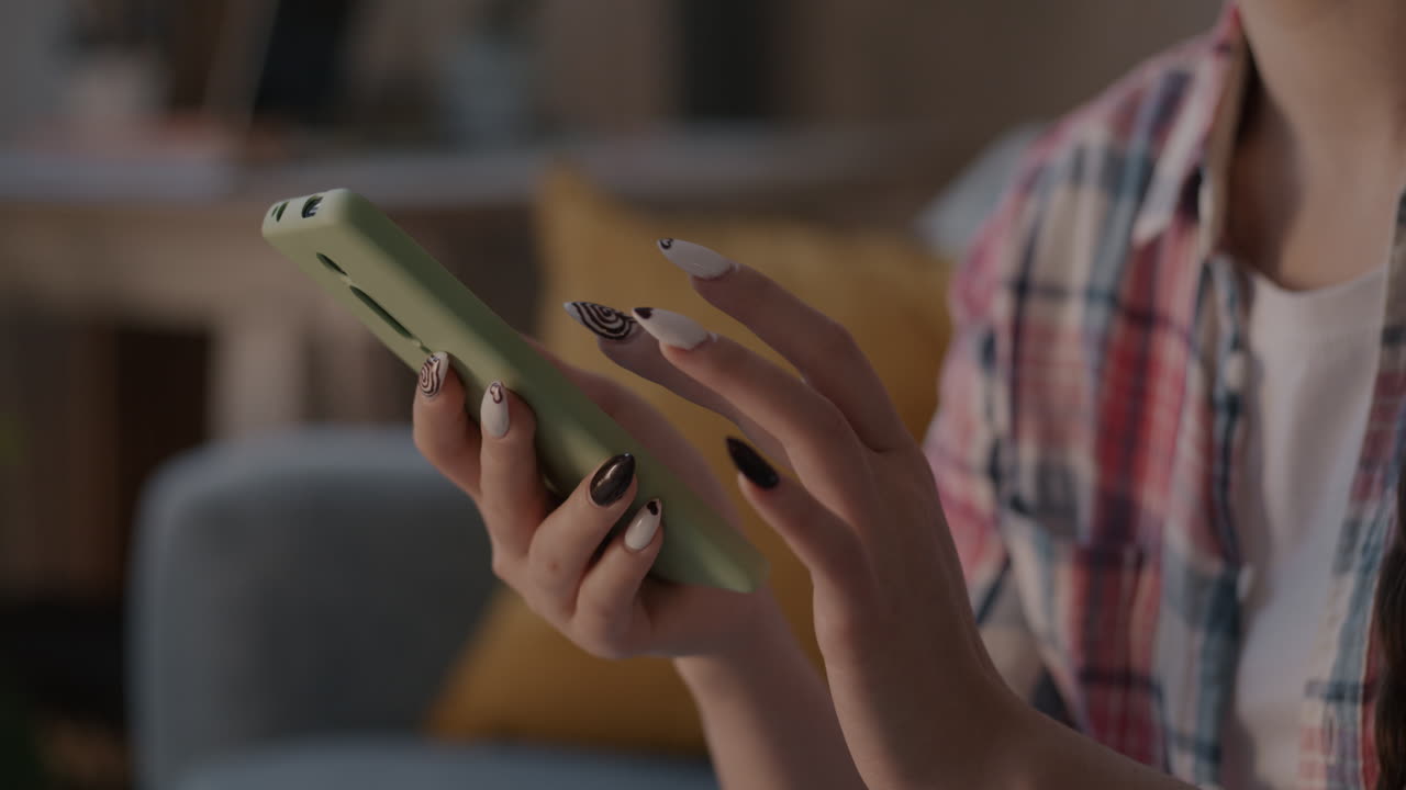 Woman using a phone in a living room