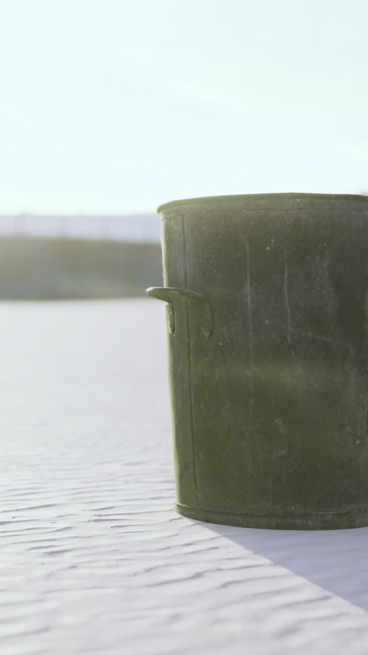 Illuminated by the gentle morning light waves softly lap at the coast