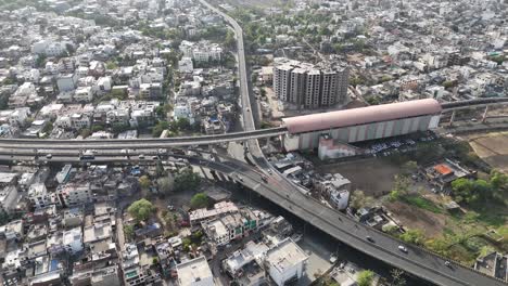 busy metro terminal with high-rise construction and elevated tracks in jaipur