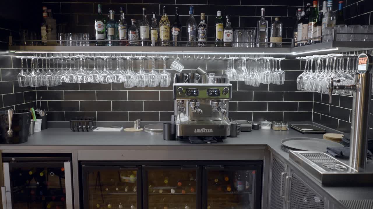 Modern Bar Interior with Espresso Machine and Wine Glasses