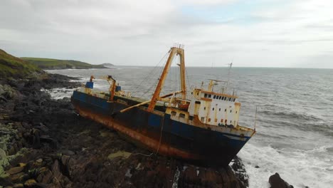 shipwreck stranded on a rocky coastline