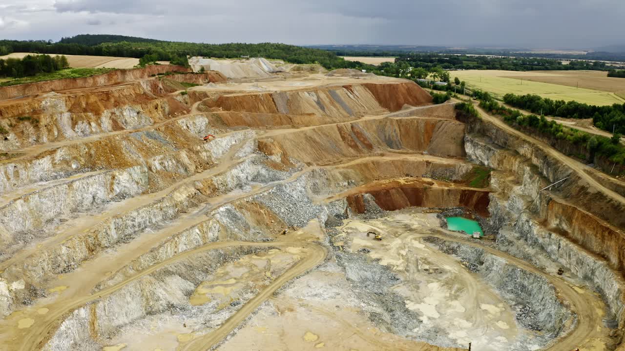 Drone Aerial Mining Video shot in Poland Kopalnia Dolny Śląsk with beautiful azure blue pond of minerals