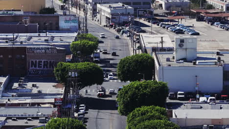 aerial view of an urban street with traffic and buildings