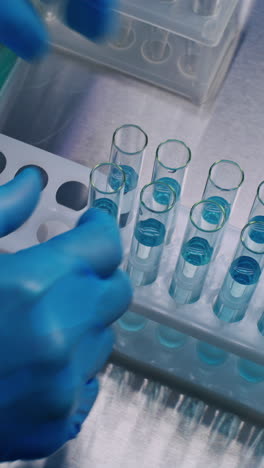 test tubes with blue liquid in a rack