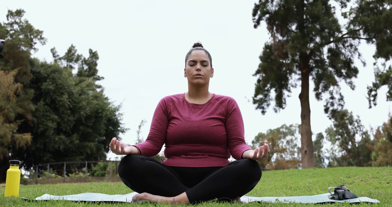 Woman Practicing Yoga Meditation in a Park
