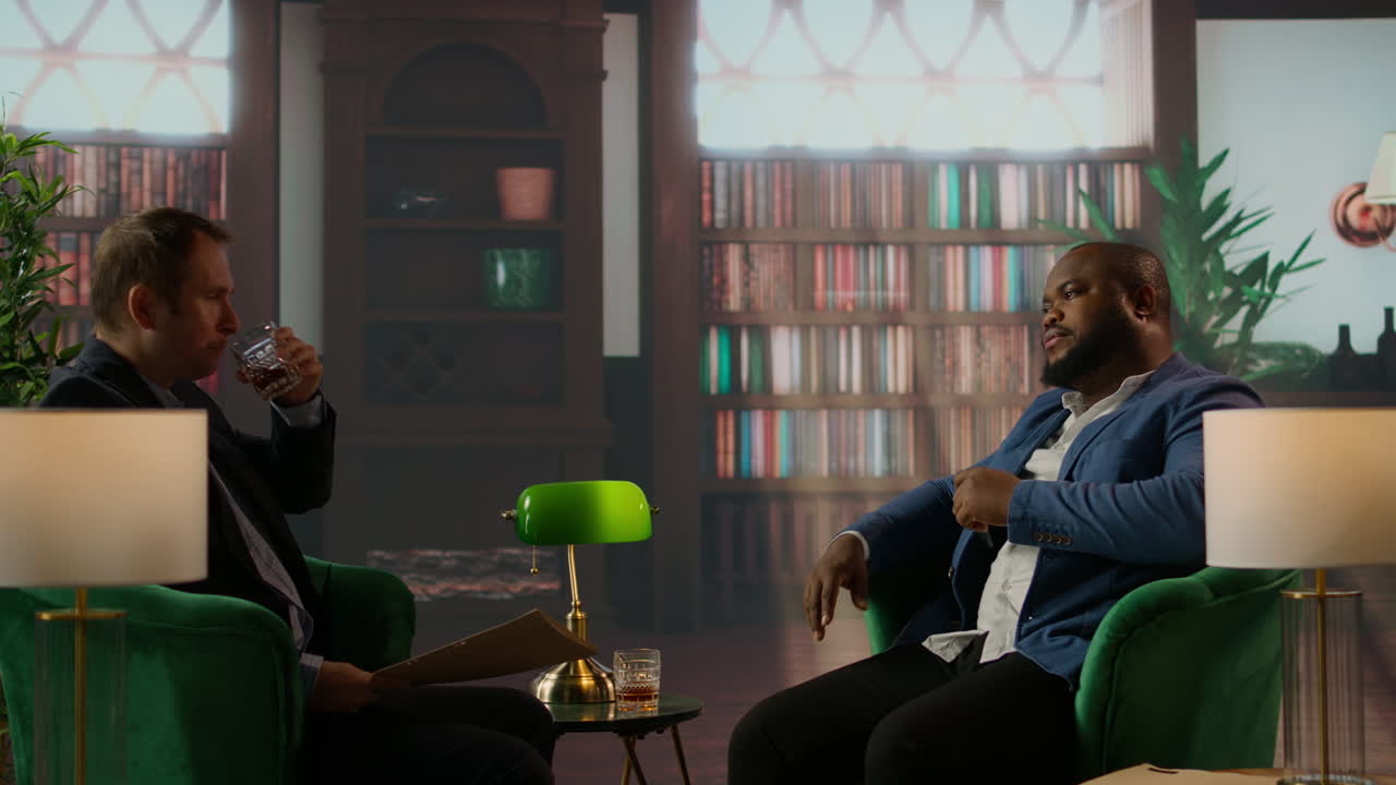 Diverse intelligence duo review a confidential hard disk over a drink