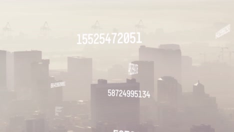 animation of changing numbers over aerial view of fog covered buildings in background