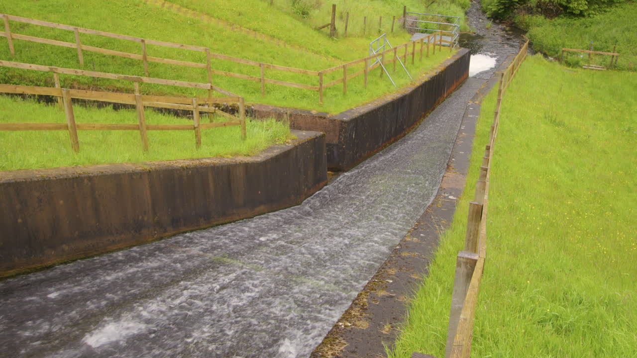 mid shot of the Cogra Moss dam spillway at Cogra Moss lake. West lake district