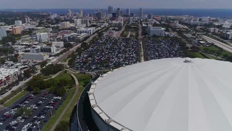 4K-Aerial-Drone-Video-of-Domed-Roof-of-Tropicana-Field-with-Waterfront-Skyline-of-Downtown-St