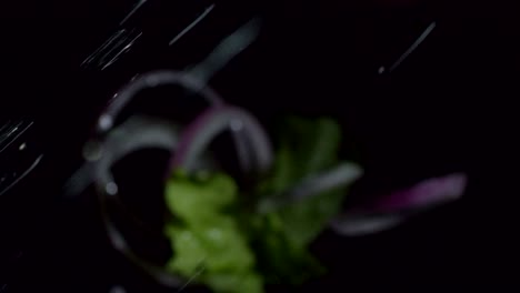 red onion rings and salad leaves