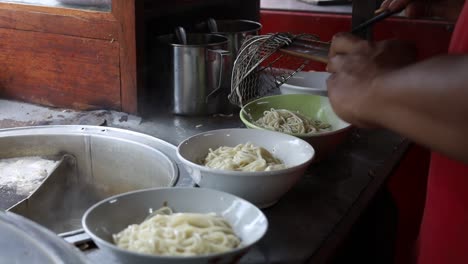 preparing chicken noodles