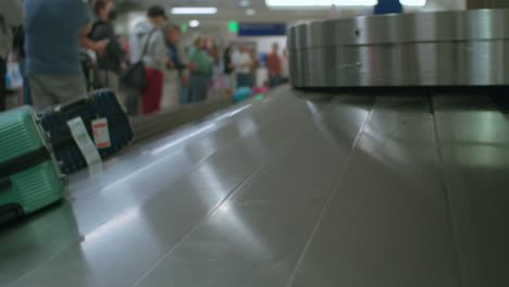 baggage moving through baggage claim