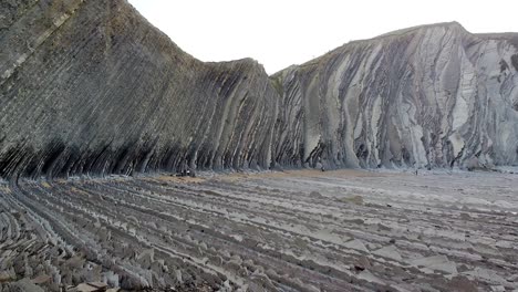 aerial drone view of the coast flysch structure in the beach of sakoneta in the basque country