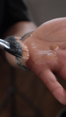 beauty shot of woman makeup artist applying foundation bb cream on previously applied moisturizing beauty shot of woman makeup artist applying foundation bb cream on previously applied moisturizing young woman face closeup concept of skincare cosmetics make up beauty
