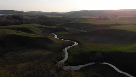 aerial shot of majestic scenic landscape with river at sunrise, travel destination in sweden