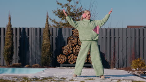 woman enjoying a winter day in the garden