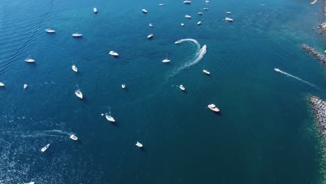 Naples,-Italy,-Revealing-Drone-Shot-of-Suburban-Coastline-and-Boats-in-Blue-Mediterranean-Sea