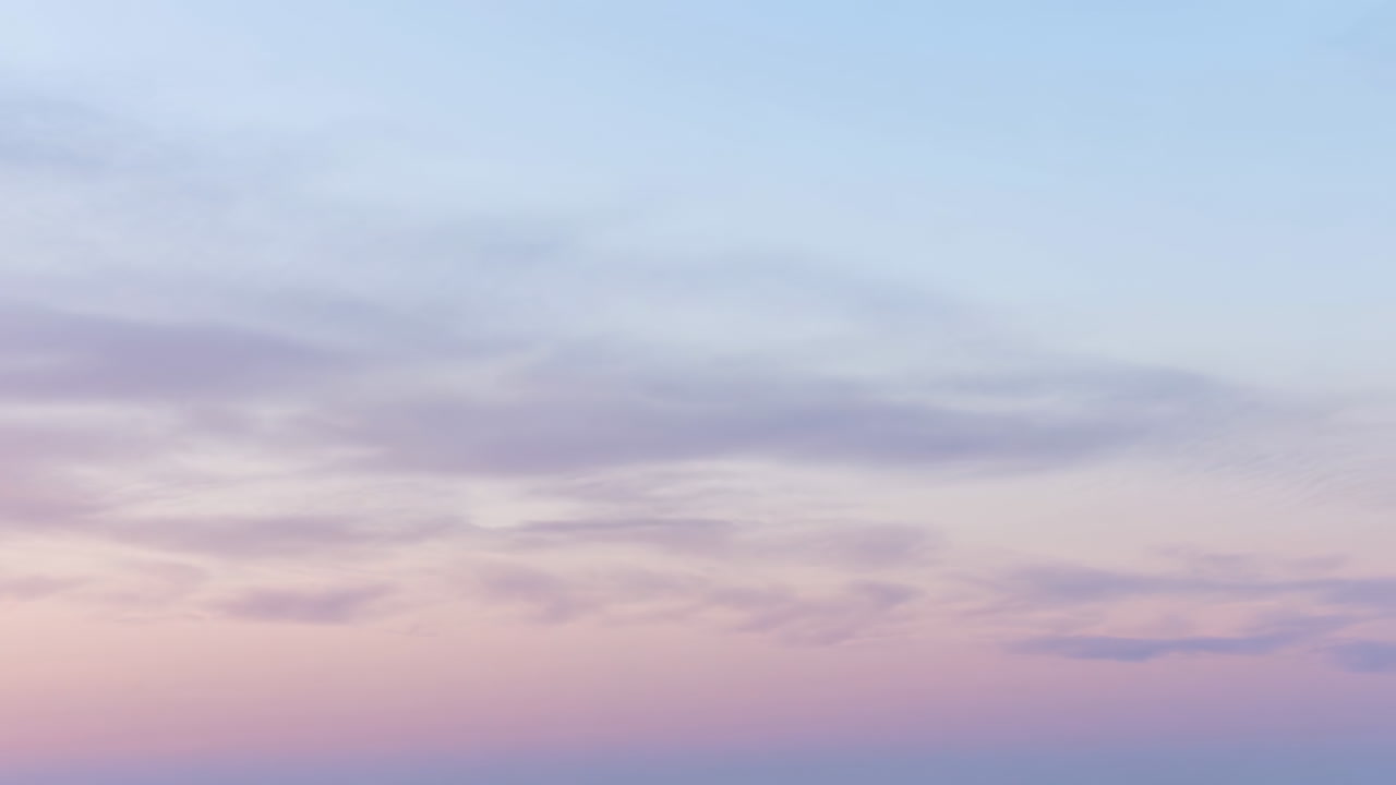 Time Lapse of Pastel Sky with Moving Clouds at Sunset