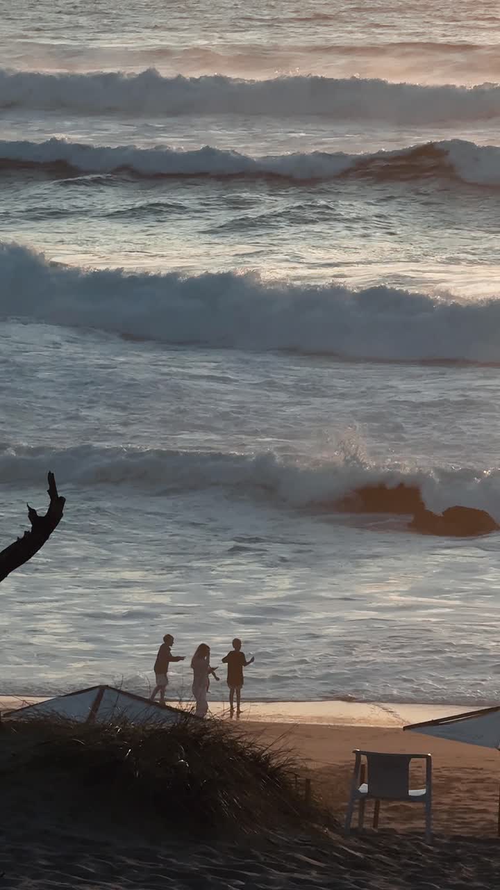 People on a Beach with Waves