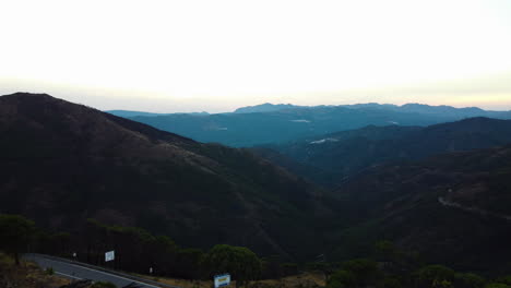 a drone rises, revealing the skyline of the sierra bermeja mountain range