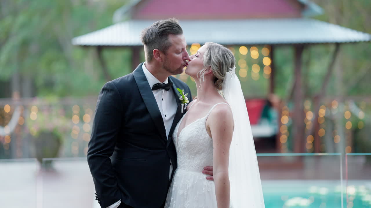 Traditional Caucasian Bride And Groom Kiss On Wedding Day Out Outdoor Event Venue In Forest, 4K Slow Motion