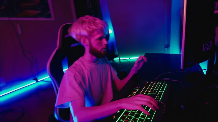 Gamer nella sua postazione da gaming ben illuminata
