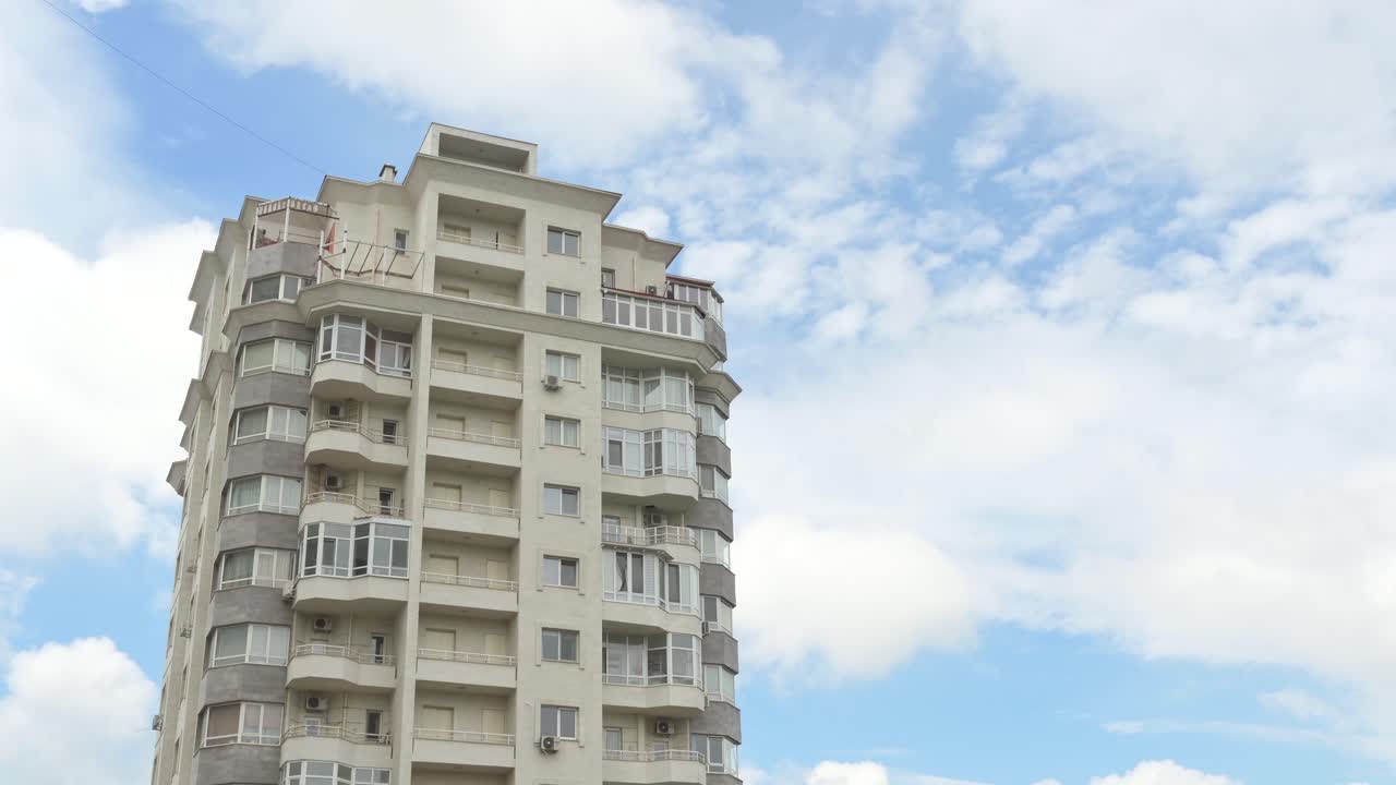 Low angle view of a white building with the sky on the background