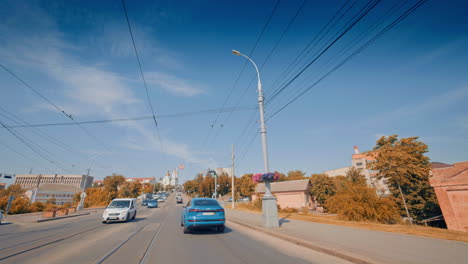 luxurious blue audi e-tron. new car driving on asphalt road through city