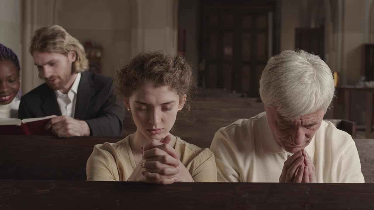 People Praying in Catholic Church