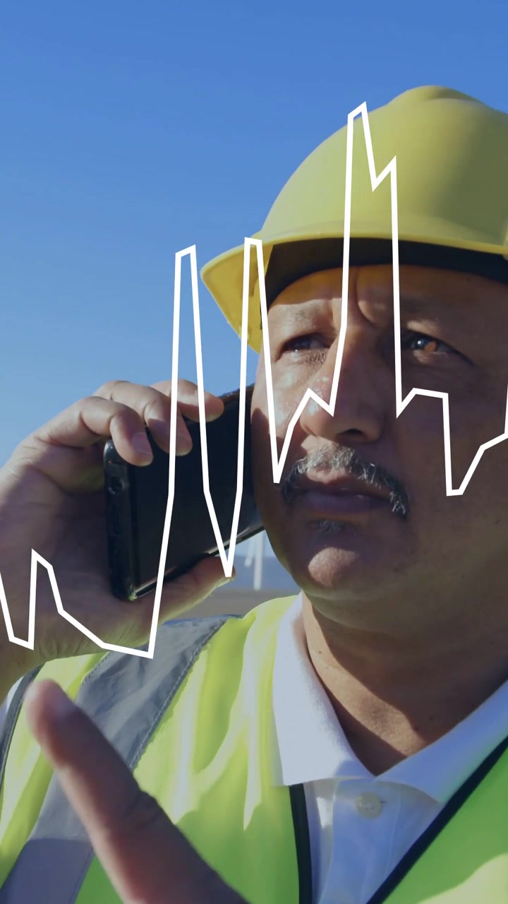 Vertical video: Man using phone, receiving call, reporting turbine status while waveform overlaying
