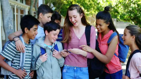 happy students taking selfie on mobile phone