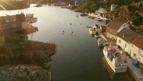 a couple padeling kayak in the coast of norway