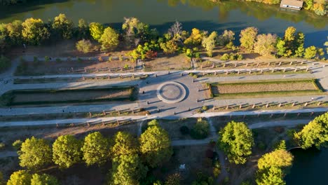 Aerial-View-Over-Lake-Herastrau-And-Rose-Island-In-Autumn,-Bucharest,-Romania