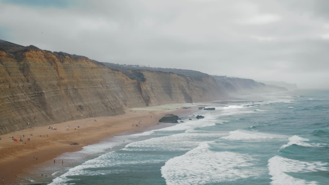 Stormy sea splashing landscape. Dark ocean waves breaking in beach vertically